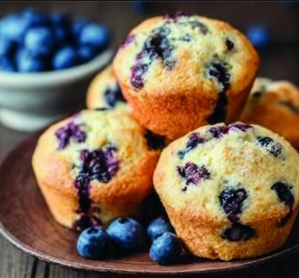 Blueberry Muffins blueberry muffins Delicious freshly baked blueberry muffins in a basket
