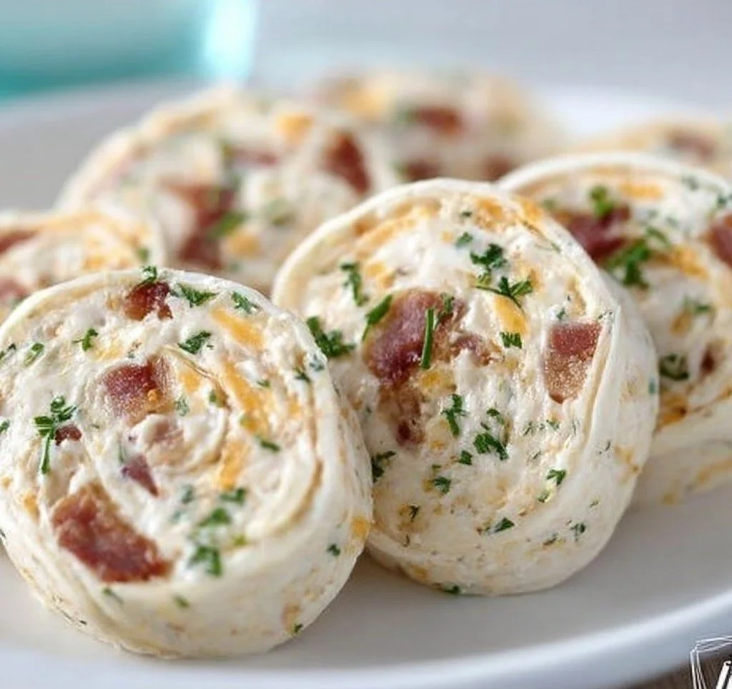 Cheddar Bacon Ranch Tortilla Pinwheels Cheddar Bacon Ranch Tortilla Pinwheels Cheddar Bacon Ranch Tortilla Pinwheels appetizer rolled with cheese and bacon
