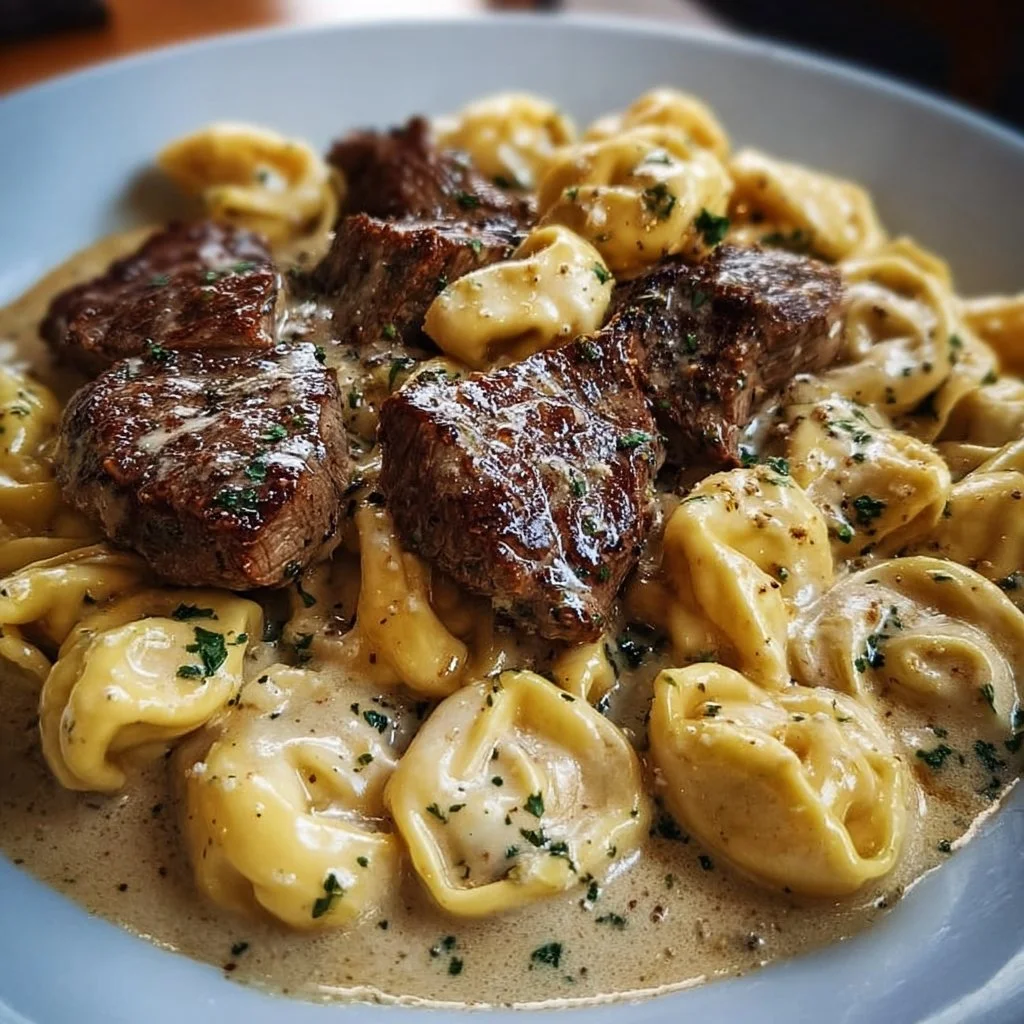 Cracked Garlic Steak Tortellini in Creamhouse Sauce Bliss steak tortellini Cracked Garlic Steak Tortellini served in Creamhouse Sauce