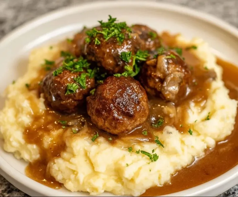 Delicious slow cooker Salisbury steak meatballs served with gravy