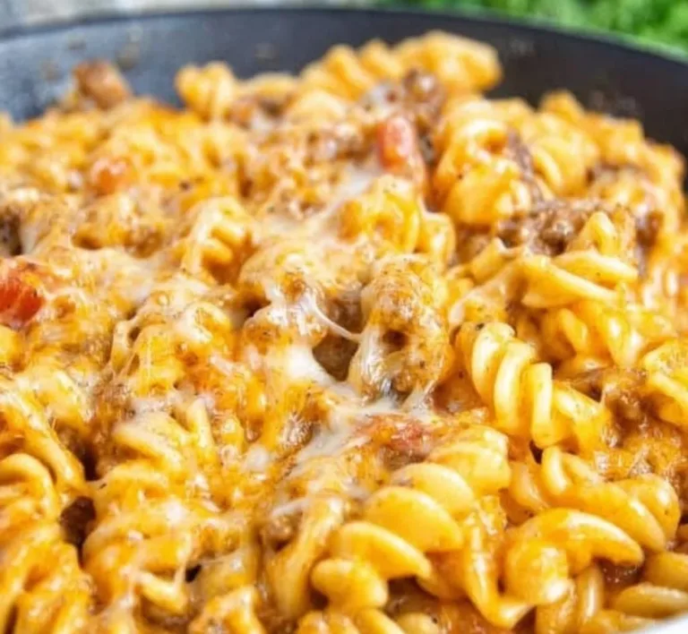 Delicious cheesy taco pasta served in a bowl with toppings